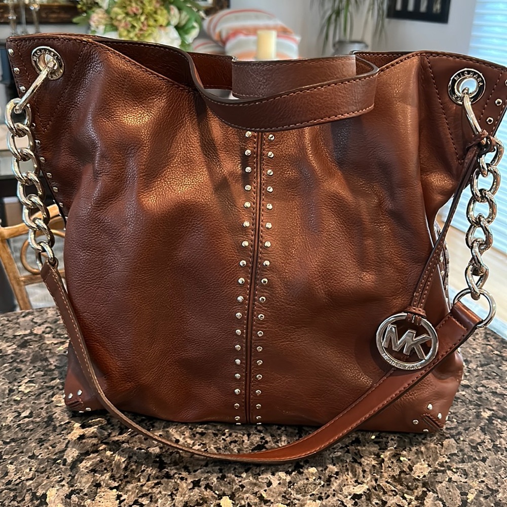 Michael Kors, brown handbag, silver accents, studs, and chain